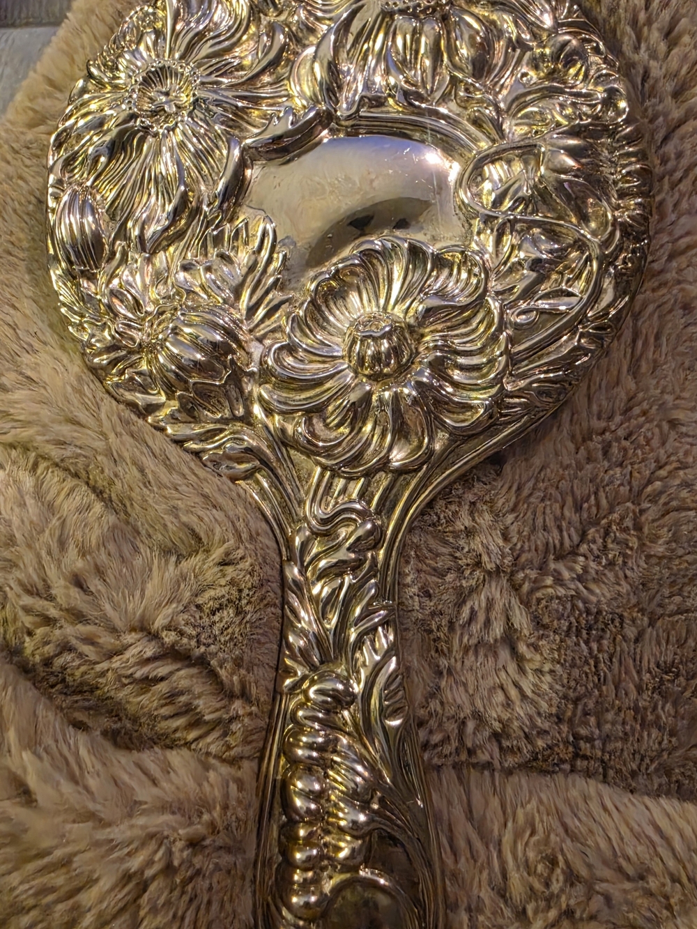 Vintage Silver-plated Handheld Vanity Mirror is a charming collectible